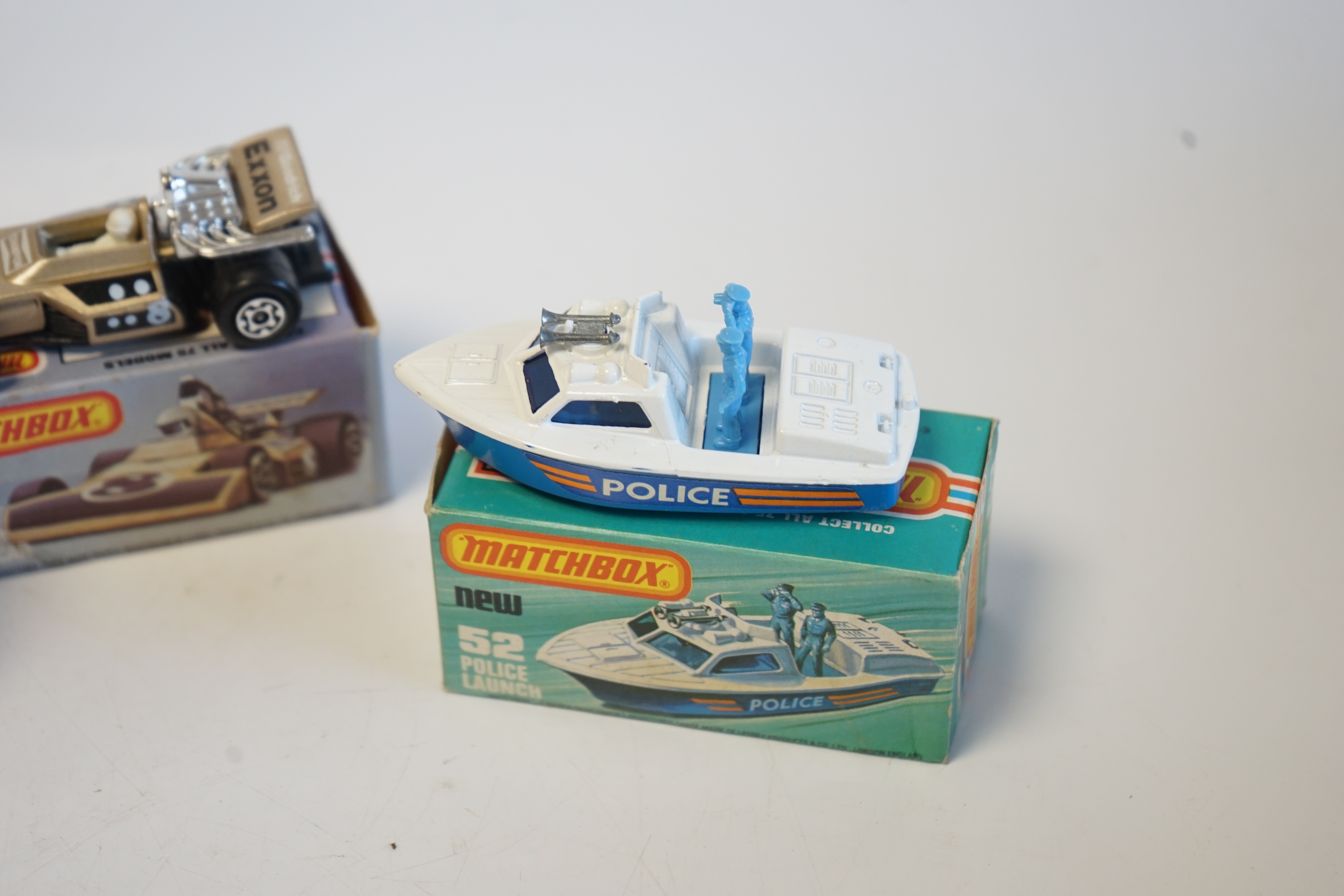 Seventeen boxed Matchbox Series 1-75 diecast vehicles including; 6; Mercedes Tourer, 9; Ford RS 2000, 10; Plymouth Police Car, 14; Petrol Tanker, 28; Formula One Racing Car and another, 30; Artic Truck, 30; Swamp Rat, 35